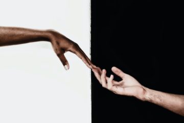 hands in front of white and black background